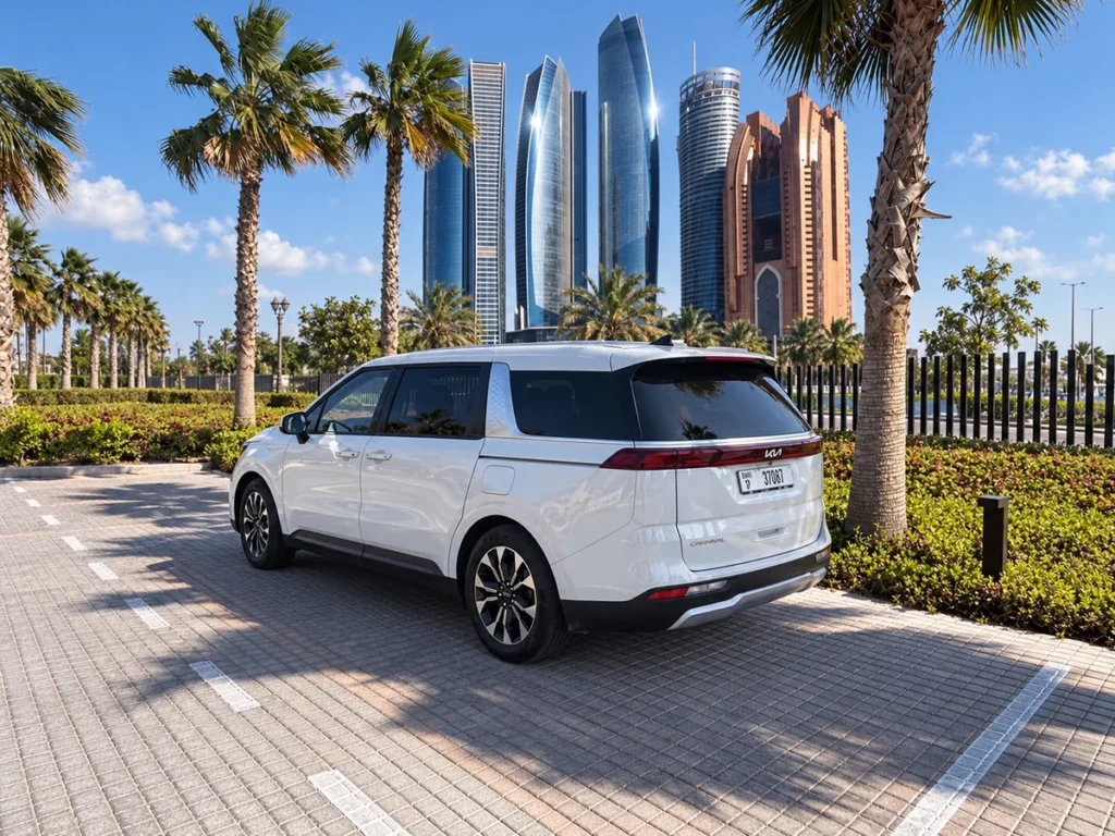 White Kia Carnival rear view